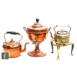 A Victorian copper samovar, height 38cm, a copper kettle, a brass kettle and a brass trivet. (4)