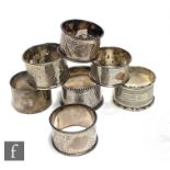 Seven early 20th Century hallmarked silver circular napkin rings, total weight 4oz, various styles