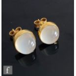 A pair of 9ct hallmarked single stone moonstone stud earrings, cabochon cut, collar set stones,