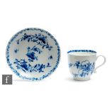 An 18th Century Worcester coffee cup and saucer decorated in the blue and white Feather Mould Floral