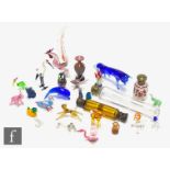 An assorted collection of glass ware to include lamp worked animals, minature vases and scent