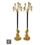 A pair of 19th Century French ormulu floorstanding candelabra by Ernest Albert Carrier-Belleuse (