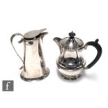 A hallmarked silver small tea pot with a silver milk jug with flip lid, total weight 19.5oz,