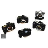 A collection of Canon camera bodies, to include EOS 300V, EOS 5000, EOS 100, EOS 600, EOS 10, all