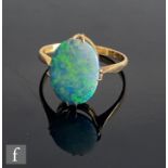 An early 20th Century 9ct opal doublet ring, oval claw set stones length 14mm, weight 2g, to knife