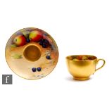 A Royal Worcester Fallen Fruits cabinet cup and saucer decorated by Austin, the interior of the