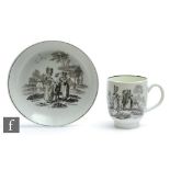 A 18th Century Worcester coffee cup and saucer decorated in the black and white transfer applied