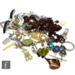 A parcel lot of assorted costume and other jewellery to include, watches, beads, brooches, pendants,