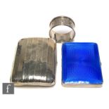 Two hallmarked silver rectangular cigarette cases, one plain the other with blue enamel