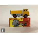 A Dinky Toys 435 Bedford TK Tipper diecast model, with yellow cab with yellow roof, red interior and