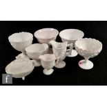 A collection of late 19th Century North Counties white pressed glass wares to include a covered