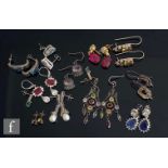 Twelve assorted silver and metal stone set earrings to include semi precious and paste set examples.
