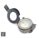 A World War Two pocket compass by T.G.Co Ltd No 2279224, 1943 MKIII.