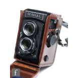 A Seagull TLR camera, serial number 03558, with original leather fitted case.