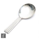 A Danish silver Bernadotte pattern caddy spoon, plain bowl and ribbed handle, length 10cm, Georg