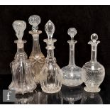 A group of assorted 19th Century clear crystal decanters to include Newcastle, globe and shaft and