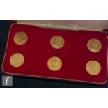 A set of Elizabeth II Isle of Man, six impaired proof 1973 sovereigns, cased.