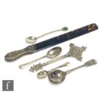 A hallmarked silver and tortoise shell journal turner, with three items of silver flatware, a