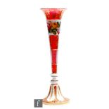 A large 19th Century Bohemian ruby glass vase in the manner of Moser of Neuwelt, the tall trumpet