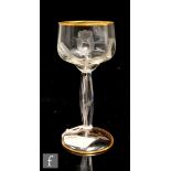 A late 19th to early 20th Century Moser crystal drinking glass with a shallow fluted bowl above a