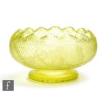 A late 19th Century Stevens & Williams uranium green glass bowl of footed compressed ovoid form with