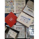 An album of Queen Elizabeth II presentation packs, together with eight albums of used world stamps