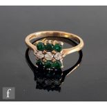 A 9ct green tourmaline and diamond nine stone floodlight ring with three central diamonds, weight