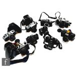 A collection of cameras to include Praktica BCA, Fujifilm Finepix, Fujica STX-1, Vivitar V2000,