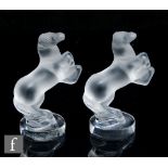 Lalique - A pair of small clear crystal glass figures titled Cheval Petit, modelled as a prancing