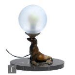 Unknown - An Art Deco bronzed spelter table lamp modelled as a seal with painted eye decoration,