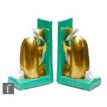 Robj - A pair of 1920s Art Deco porcelain bookends, 'Deux Disciples de Confucius en Priere', each