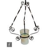 James Powell & Sons - An Arts and Crafts hanging lantern, with a wrought iron scroll frame and an