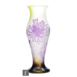Andre Delatte - An early 20th Century cameo glass vase of baluster form, cased in purple over an