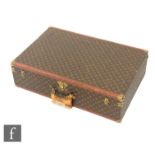 Louis Vuitton - A large Alzer hard case suitcase trunk, monogrammed leather with gold hardware,