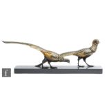 S Melani - An Art Deco bronzed spelter study, circa 1930s, of two stylised pheasants with gilt