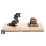 After Hippolyte Moreau - A French Art Deco patinated spelter inkwell, with a stylised toucan with