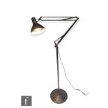 Luxo - A 1970s articulated floor lamp, the brushed aluminium circular base, extending to an