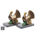 Unknown - A pair of Art Deco bronzed spelter bookends, modelled as stylised turkeys with gilt