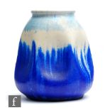 Ruskin Pottery - A crystalline glaze vase of irregular form, the ovoid body with indented sides to