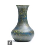 Ruskin Pottery - A vase of globe and shaft form decorated in a mottled blue and dark green