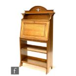 In the manner of Liberty & Co - An oak combination fall front bureau bookcase, the upper section