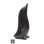 Perry Lancaster - A contemporary carved hardwood figure, modelled as a stylised penguin, signed