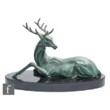 Unknown - A French Art Deco green patinated spelter figure modelled as a recumbent stag, mounted