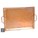 John Pearson - An early 20th Century Arts and Crafts copper twin handled rectangular tray with a