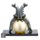 EXE - An Art Deco aluminium and brass Pierrot figural table lamp, with two Pierrot clowns