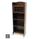Unknown - An Arts and Crafts oak cabinet bookcase, with galleried shelf above a leaded glazed door