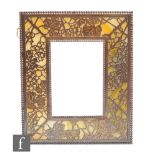 Attributed to Tiffany Studio - An early 20th Century favrile glass and bronze photograph frame in