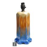 Ruskin Pottery - A crystalline glaze hexagonal lamp base decorated in mustard to orange to blue with