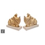 Argilor - A pair of 1930s French Art Deco bookends modelled as three graduated long haired Chinese