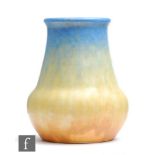 Ruskin Pottery - A small crystalline glaze vase decorated in blue to yellow to orange, impressed